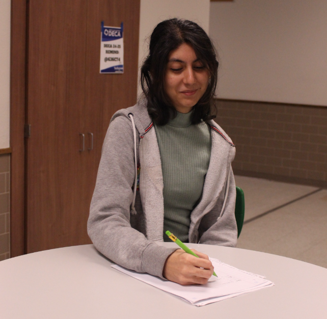 Izma Munawar preparing her schedule for the next year. This is her third time creating a schedule in her high school career.